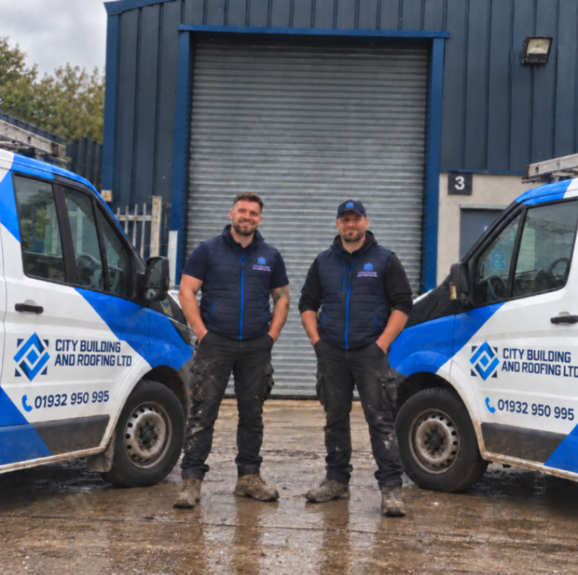 The City Building & Roofing Ltd team with branded vans